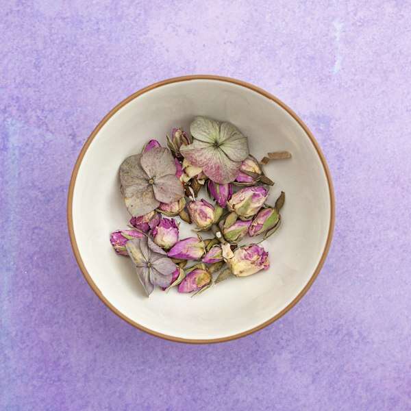 Bowl of dried flower petals for herbal tea